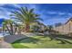 Beautiful backyard featuring a putting green, mature landscaping, and a serene atmosphere for outdoor enjoyment at 1078 W Desert Aster Rd, San Tan Valley, AZ 85143