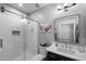 Modern bathroom featuring a vanity, mirror, toilet and glass enclosed shower at 1078 W Desert Aster Rd, San Tan Valley, AZ 85143