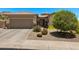 Charming single-story home featuring a well-maintained front yard and a two-car garage at 1078 W Desert Aster Rd, San Tan Valley, AZ 85143