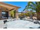 Relaxing backyard hot tub with a covered patio and ample seating, ideal for unwinding and enjoying the outdoors at 1078 W Desert Aster Rd, San Tan Valley, AZ 85143