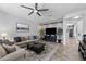 Comfortable living room with plush seating, a ceiling fan, and neutral tones offers a serene and inviting atmosphere at 1078 W Desert Aster Rd, San Tan Valley, AZ 85143