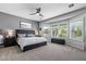 Serene main bedroom with large windows and plantation shutters, offering a tranquil retreat for relaxation at 1078 W Desert Aster Rd, San Tan Valley, AZ 85143