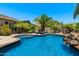 Beautiful swimming pool surrounded by lush landscaping, creating a private backyard oasis at 1078 W Desert Aster Rd, San Tan Valley, AZ 85143
