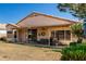 Back of the home features a large covered patio perfect for relaxing and enjoying outdoor living at 11518 W Dana Ln, Avondale, AZ 85392