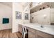 Well-lit bathroom featuring a large mirror, dual sinks, and plenty of counter space at 11518 W Dana Ln, Avondale, AZ 85392