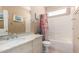 A neutral color bathroom with a vanity, sink, mirror, toilet, and shower-tub combination at 11518 W Dana Ln, Avondale, AZ 85392