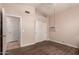 A second bedroom features tile flooring, a ceiling fan, and a double door closet for storage at 11518 W Dana Ln, Avondale, AZ 85392