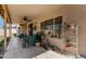 Covered patio with tile flooring, a ceiling fan, and furniture create an inviting outdoor space at 11518 W Dana Ln, Avondale, AZ 85392
