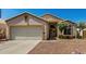 Charming single-Gathering home featuring a two-car garage and desert landscaping at 11518 W Dana Ln, Avondale, AZ 85392