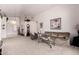 Inviting living room with neutral carpet, high ceilings, and comfortable furnishings at 11518 W Dana Ln, Avondale, AZ 85392