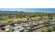 Aerial view of homes in a golf community with beautiful desert landscaping and mountain views at 12021 S Tomi Dr, Phoenix, AZ 85044