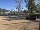 Bocce ball court with shaded seating for spectators, inviting relaxation and friendly competition at 12021 S Tomi Dr, Phoenix, AZ 85044