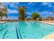 Community pool with lane markers, clear water, and lounge chairs. Great for exercise and relaxation at 12021 S Tomi Dr, Phoenix, AZ 85044