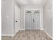 Welcoming entryway featuring modern wood-look floors and neutral paint, creating a bright and open space at 12021 S Tomi Dr, Phoenix, AZ 85044