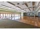 Spacious event room with versatile flooring, stage and ample natural light at 12021 S Tomi Dr, Phoenix, AZ 85044