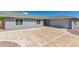 Charming single-story home with a well-manicured front yard and spacious two-car garage on a sunny day at 12021 S Tomi Dr, Phoenix, AZ 85044