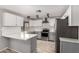 Stylish renovated kitchen boasts sleek countertops, stainless steel appliances, and contemporary fixtures at 12021 S Tomi Dr, Phoenix, AZ 85044