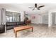 Open living space seamlessly connects to the kitchen, featuring modern flooring and access to the backyard at 12021 S Tomi Dr, Phoenix, AZ 85044