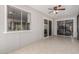 Bright sunroom featuring wall to wall windows and a sliding door to the backyard at 12021 S Tomi Dr, Phoenix, AZ 85044