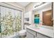 Well-lit bathroom with a shower-tub combo and a vanity at 13207 N 98Th Ave # L, Sun City, AZ 85351