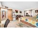 Spacious carpeted bedroom featuring a double bed, shelving, and closet at 13207 N 98Th Ave # L, Sun City, AZ 85351