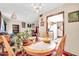 Cozy dining room with wood table, chairs, and seamless flow into the kitchen area at 13207 N 98Th Ave # L, Sun City, AZ 85351