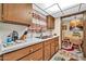 Well-maintained kitchen with wooden cabinets, and modern sink, offering a functional space at 13207 N 98Th Ave # L, Sun City, AZ 85351