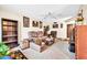 Spacious living room with comfortable seating, ceiling fan, and natural light at 13207 N 98Th Ave # L, Sun City, AZ 85351
