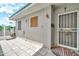 Relaxing outdoor patio with tile flooring, screen door, and ample natural light at 13207 N 98Th Ave # L, Sun City, AZ 85351