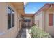 Inviting entrance with a decorative iron gate and well-manicured greenery at 13224 N 98Th Ave # L, Sun City, AZ 85351