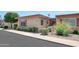 Cozy single-story home with well-maintained landscaping and a charming entryway at 13224 N 98Th Ave # L, Sun City, AZ 85351