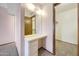 A hallway with built-in vanity and door to a walk-in closet at 13224 N 98Th Ave # L, Sun City, AZ 85351