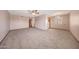 Open living area with neutral carpet and ample space for furniture arrangement at 13224 N 98Th Ave # L, Sun City, AZ 85351