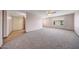 Spacious living room with neutral carpet and a bright, airy feel at 13224 N 98Th Ave # L, Sun City, AZ 85351