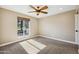 Bedroom with neutral walls, carpet, a ceiling fan, recessed lights, and a window with view of the front yard at 14029 N Burning Tree Pl, Phoenix, AZ 85022