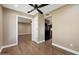 View through an open doorway in a bonus room into the kitchen, and a ceiling fan at 14029 N Burning Tree Pl, Phoenix, AZ 85022