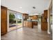 Open concept kitchen with tile flooring, hardwood cabinets, stainless steel appliances and granite countertops at 14029 N Burning Tree Pl, Phoenix, AZ 85022