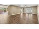 Spacious living room with hard wood flooring, patio access, and light-colored walls at 14029 N Burning Tree Pl, Phoenix, AZ 85022