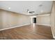 A bright and spacious living room with hard wood flooring, recessed lighting, and modern ceiling fan at 14029 N Burning Tree Pl, Phoenix, AZ 85022