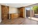 Bonus room with hard wood flooring, custom cabinets, granite counter tops, and access to outdoor patio at 14029 N Burning Tree Pl, Phoenix, AZ 85022