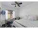 Bright bedroom with a window-side desk and a comfortable bed, ideal for relaxation and productivity at 1411 E Orangewood Ave # 237, Phoenix, AZ 85020