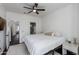 Comfortable bedroom with a ceiling fan and dark wood floors, offering a relaxing atmosphere at 1411 E Orangewood Ave # 237, Phoenix, AZ 85020