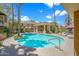 Relaxing community pool featuring a hot tub and plenty of space to lounge at this amazing condo at 1411 E Orangewood Ave # 237, Phoenix, AZ 85020