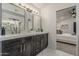 Elegant bathroom with double sink vanity, marble floors, and stylish lighting at 1444 E Boston St, Chandler, AZ 85225