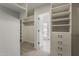 Spacious walk-in closet with custom shelving and drawers offers ample storage at 1444 E Boston St, Chandler, AZ 85225