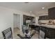 Dining space flows into the kitchen, offering a seamless transition for entertaining guests at 1444 E Boston St, Chandler, AZ 85225