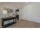 Entryway featuring modern console table, artwork, and a glimpse into the updated kitchen at 1444 E Boston St, Chandler, AZ 85225