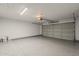 Spacious two car garage with durable epoxy flooring and an automatic door opener system at 1444 E Boston St, Chandler, AZ 85225