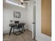 Bright home office featuring a modern desk, ceiling fan, and natural light from a window at 1444 E Boston St, Chandler, AZ 85225