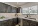 Modern kitchen with stainless steel appliances, gorgeous countertops and dark wood cabinets at 1444 E Boston St, Chandler, AZ 85225